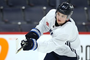 Cole Perfetti shoots during Winnipeg Jets practice yesterday. The forward will play his 10th game in the NHL on Thursday night.