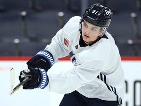 Cole Perfetti shoots during Winnipeg Jets practice yesterday. The forward will play his 10th game in the NHL on Thursday night.