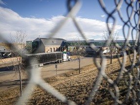 A transport truck crosses the border at Coutts, Alta., Thursday, Nov. 4, 2021.