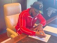 Defensive back DeAundre Alford signs his contract with the NFL's Atlanta Falcons on Monday, Jan. 10, 2022. Alford led the Winnipeg Blue Bombers with four interceptions and was second with 48 tackles last season, helping the Blue Bombers win the Grey Cup in his rookie season with the CFL club.