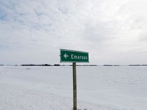 A sign post for the small border town of Emerson, near the Canada-U.S border crossing in Emerson, Manitoba, Canada, February 1, 2017. REUTERS/Lyle Stafford//File Photo