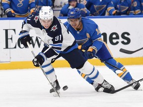 St. Louis Blues center Brayden Schenn (10) pressures Winnipeg Jets center Cole Perfetti (91) during the first period at Enterprise Center in St. Louis on Jan. 29, 2022.