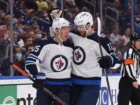 Winnipeg Jets center Paul Stastny (25) is congratulated by Winnipeg Jets center Adam Lowry (17) after scoring a goal against the St. Louis Blues during the first period at Enterprise Center in St. Louis on Jan. 29, 2022.