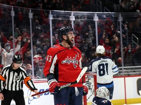 Tom Wilson (43) of the Washington Capitals celebrates after scoring the winning goal in overtime giving the Capitals a 4-3 over the Winnipeg Jets at Capital One Arena on Jan. 18, 2022 in Washington, DC.