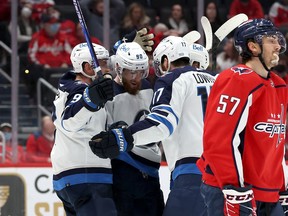 Pierre-Luc Dubois (80) of the Winnipeg Jets celebrates after scoring a third period goal at Capital One Arena on January 18, 2022 in Washington, DC.