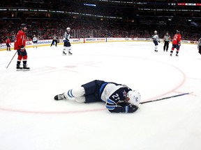 Nikolaj Ehlers (27) of the Winnipeg Jets is injured in the third period against the Washington Capitals at Capital One Arena on Jan. 18, 2022 in Washington, DC.