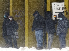 People line up outside the COVID-10 testing site at the Garrick Centre in downtown Winnipeg on Tues., Jan. 4, 2022.  KEVIN KING/Winnipeg Sun/Postmedia Network