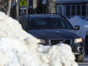 Snow piles are making it difficult for drivers to see oncoming vehicle in some spots of Winnipeg on Monday, Jan. 23, 2022.