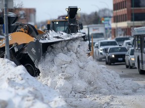 Snow removal in progress in Winnipeg on Friday. On Friday, the City's finance committee approved a $6.9 million overspend in the Public Works Department to cover the cost of snow removal in 2021 due to high snow accumulations.