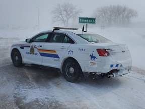 An RCMP cruiser sits parked near the Canada/United States border crossing at Emerson, Man., in a photo released Friday, Feb. 11, 2022 by Manitoba RCMP.
