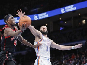 Raptors' Pascal Siakam goes to the basket as Oklahoma City Thunder's Kenrich Williams defends during the second quarter at Paycom Center on Wednesday, Feb. 9, 2022.