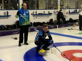 Skip Jacques Gauthier calls a shot as opposing skip Sean Grassie looks on during a game at the Manitoba men’s curling championship in Selkirk, Man., on Feb. 10, 2022.
