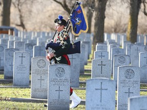 Piper Sgt. Cameron Dawson of the Queen's Own Cameron Highlanders, plays in the Field of Honour at Brookside Cemetery in Winnipeg, Man. Sunday November 6, 2016.