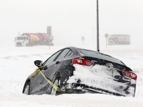 A car stuck in the ditch near the Highway 6 offramp to the Perimeter Highway on Tues., Jan. 18, 2022.  KEVIN KING/Winnipeg Sun/Postmedia Network