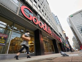 A woman walks by a closed GoodLife Fitness centre in Toronto, Ontario, on January 5, 2022.