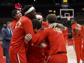 Pascal Siakam and thec rest of the Toronto Raptors congratulate Fred VanVleet as he is announced to be on the all-star team prior to their NBA game against the Chicago Bulls at Scotiabank Arena on February 3, 2022 in Toronto.