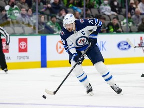 Winnipeg Jets right wing Blake Wheeler (26) celebrates with teammates after defeating the Nashville Predators at Bridgestone Arena in Nashville on Feb. 12, 2022. Changes to player leadership means Wheeler will no longer captain the team, it was announced Friday morning.