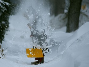 A person shovels snow