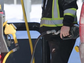 A man pumps his gasoline at a south Winnipeg station on Mon., Feb. 7, 2022.  KEVIN KING/Winnipeg Sun/Postmedia Network