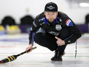 Mike McEwen watches his shot during the provincial men's curling championship at the Selkirk Curling Club in Selkirk on Sunday, Feb. 13, 2022.