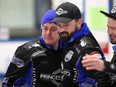 An emotional Colin Hodgson (left) celebrates a provincial men's curling championship victory with Reid Carruthers (centre) and Mike McEwen at the Selkirk Curling Club in Selkirk on Sunday, Feb. 13, 2022.