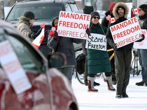 Messaging at the Freedom Convoy protest outside the Manitoba Legislative Building in Winnipeg on Monday, Feb. 14, 2022.