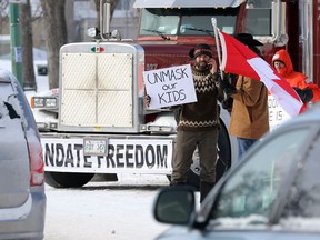 Messaging at the Freedom Convoy protest outside the Manitoba Legislative Building in Winnipeg on Monday, Feb. 14, 2022.