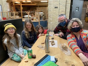 Medical doctors Alice Gwyn, Mark Walton and their children spoke with the Winnipeg Sun at The Forks market on Tuesday, March 15, 2022. James Snell/Winnipeg Sun