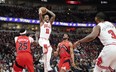 Chicago Bulls' DeMar DeRozan looks to pass the ball against the Raptors during the first quarter at United Center in Chicago on Monday, March 21, 2022.