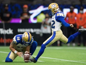 Blue Bombers’ Ali Mourtada (right) is on the short list for next season’s kicking job, but has been told by the coaching staff what he needs to do to improve if he wants to make it.  Darryl Dyck/THE CANADIAN PRESS