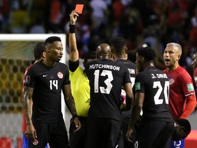 Canada's Mark-Anthony Kaye (14) is shown a red card by referee Said Martinez in a World Cup qualifying game at the National Stadium of Costa Rica in San Jose, Costa Rica on March 24, 2022.