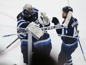 Mark Scheifele (55) of the Winnipeg Jets celebrates his game-winning goal against the Arizona Coyotes in overtime during a game on March 27, 2022 at Canada Life Centre in Winnipeg.