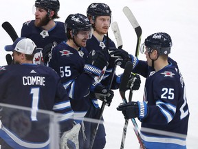 Mark Scheifele (55) of the Winnipeg Jets celebrates his game-winning goal against the Arizona Coyotes in overtime during a game on Sunday, March 27, 2022 at Canada Life Centre in Winnipeg.