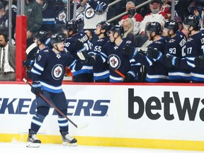 Winnipeg Jets forward Evgeny Svechnikov (71) is congratulated by his team mates on his goal against the Montreal Canadiens during the first period at Canada Life Centre in Winnipeg on Tuesday, March 1, 2022.