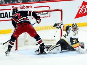 Winnipeg Jets forward Adam Lowry (17) scores on Vegas Golden Knights goalie Logan Thompson (36) during the third period at Canada Life Centre in Winnipeg on Tuesday, March 15, 2022.