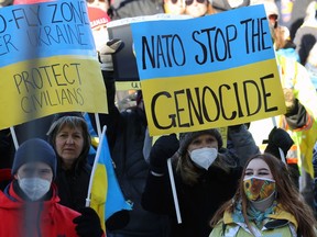 Hundreds of people attend the Stand With Ukraine rally at the Manitoba Legislative Building in Winnipeg on Sunday, March 6, 2022.