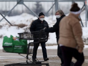 People wear masks while in public in Winnipeg on Tuesday, after the province lifted the mask mandate. Chris Procaylo/Winnipeg Sun