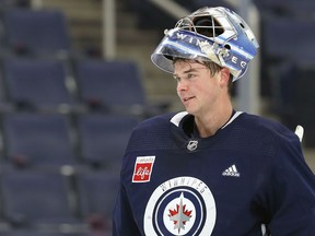 Eric Comrie is pictured at Winnipeg Jets practice on Wed., March 23, 2022.  KEVIN KING/Winnipeg Sun/Postmedia Network