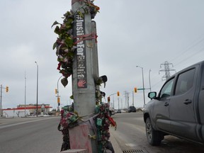 A memorial for Eishia Hudson that includes the phrase #JusticeForEishia stands at the corner of Fermor Avenue and Lagimodiere Boulevard in Winnipeg. Hudson was 16 years old in April of 2020 when she was shot and killed near that same intersection by a Winnipeg Police office. Photo by Dave Baxter/Local Journalism Initiative/Winnipeg Sun