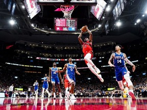 Precious Achiuwa of the Toronto Raptors goes to the basket against Danny Green of the Philadelphia 76ers during the second half of their basketball game at the Scotiabank Arena on April 7, 2022 in Toronto, Ontario, Canada.