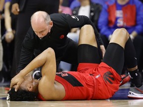 Scottie Barnes of the Toronto Raptors receives medical attention during the fourth quarter against the Philadelphia 76ers during Game One of the Eastern Conference First Round at Wells Fargo Center on April 16, 2022 in Philadelphia, Pennsylvania.