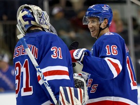 Igor Shesterkin (left) and Ryan Strome of the New York Rangers celebrate the win over the Winnipeg Jets.