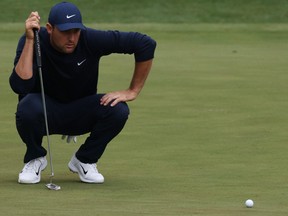 Scottie Scheffler looks at his birdie putt on the 16th green during the second round at the Masters.