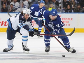 Morgan Barron (left) chases down Maple Leafs defenceman Morgan Rielly on Thursday, April 2, 2022 at Scotiabank Arena. While the Jets broadcast crew head out on the road to broadcast games, their Toronto counterparts are not on site for road games this season.