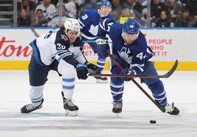 Morgan Barron (left) chases down Maple Leafs defenceman Morgan Rielly on Thursday, April 2, 2022 at Scotiabank Arena. While the Jets broadcast crew head out on the road to broadcast games, their Toronto counterparts are not on site for road games this season.