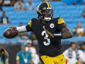 Dwayne Haskins of the Pittsburgh Steelers looks to pass against the Carolina Panthers during an NFL preseason game at Bank of America Stadium on August 27, 2021 in Charlotte, North Carolina.