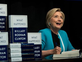 Former U.S. Secretary of State Hillary Clinton signs copies of her new book "What Happened" during a book signing event at Barnes and Noble bookstore in New York City, Sept. 12, 2017.