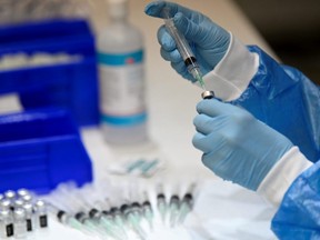 The Pfizer-BioNTech vaccine is prepared at the Palais des Congres in Montreal, during the COVID-19 pandemic, March 15, 2021.