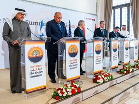 A handout image provided by the United Arab Emirates News Agency (WAM) on March 28, 2022, shows (L to R) Bahrain's Foreign Minister Abdullatif bin Rashid al-Zayani, Egypt's Foreign Minister Sameh Shoukry, Israeli Foreign Minister Yair Lapid, US Secretary of State Antony Blinken, Morocco's Foreign Minister Nasser Bourita, and Emirati Minister of Foreign Affairs and International Cooperation Abdullah bin Zayed Al Nahyan during the Negev summit in the Israeli kibbutz of Sde Boker.