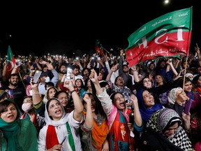 Supporters of the Pakistan Tehreek-e-Insaf (PTI) political party light up their mobile phones and chant slogans in support of Pakistani Prime Minister Imran Khan during a rally, in Islamabad, Pakistan April 4, 2022.